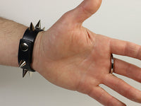cone spiked bracelet and o ring, palm view