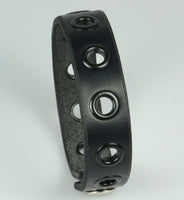 leather bracelet with black eyelets