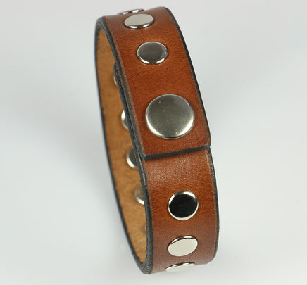 snap closure on brown leather bracelet with rivets