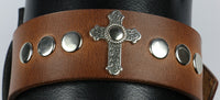 Cross is riveted to the cuff, won't fall off!