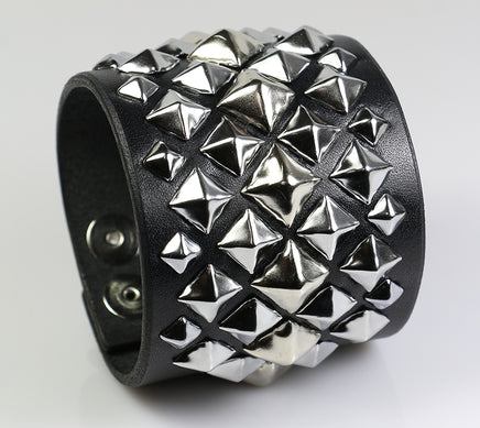 diagonal pyramid studded wrist cuff with multi sized pyramid spots