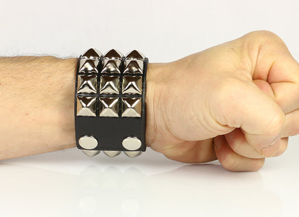 three row pyramid wristband seen on wrist